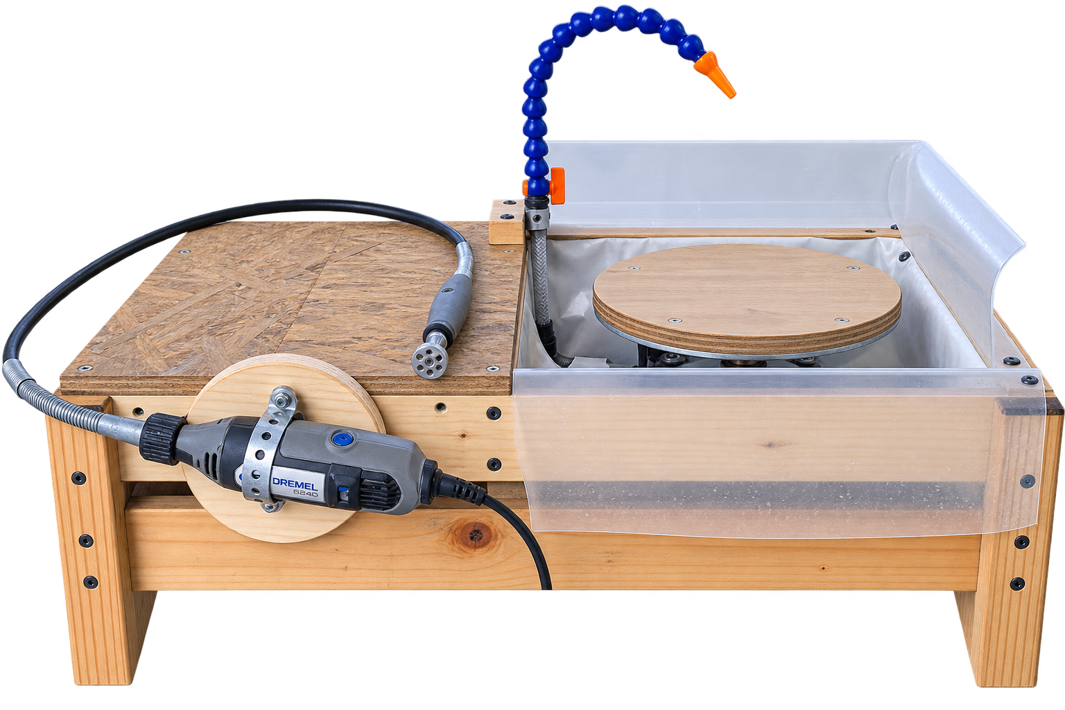 Rotary-vise frame with lazy-susan bearing bolted directly to it, sitting beside the water trough, stone slab screwed to a round wood disc, submersible pump and coolant line alongside